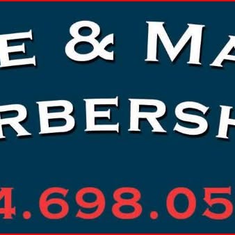 The hand-painted Eddie & Mark's Barbershop sign